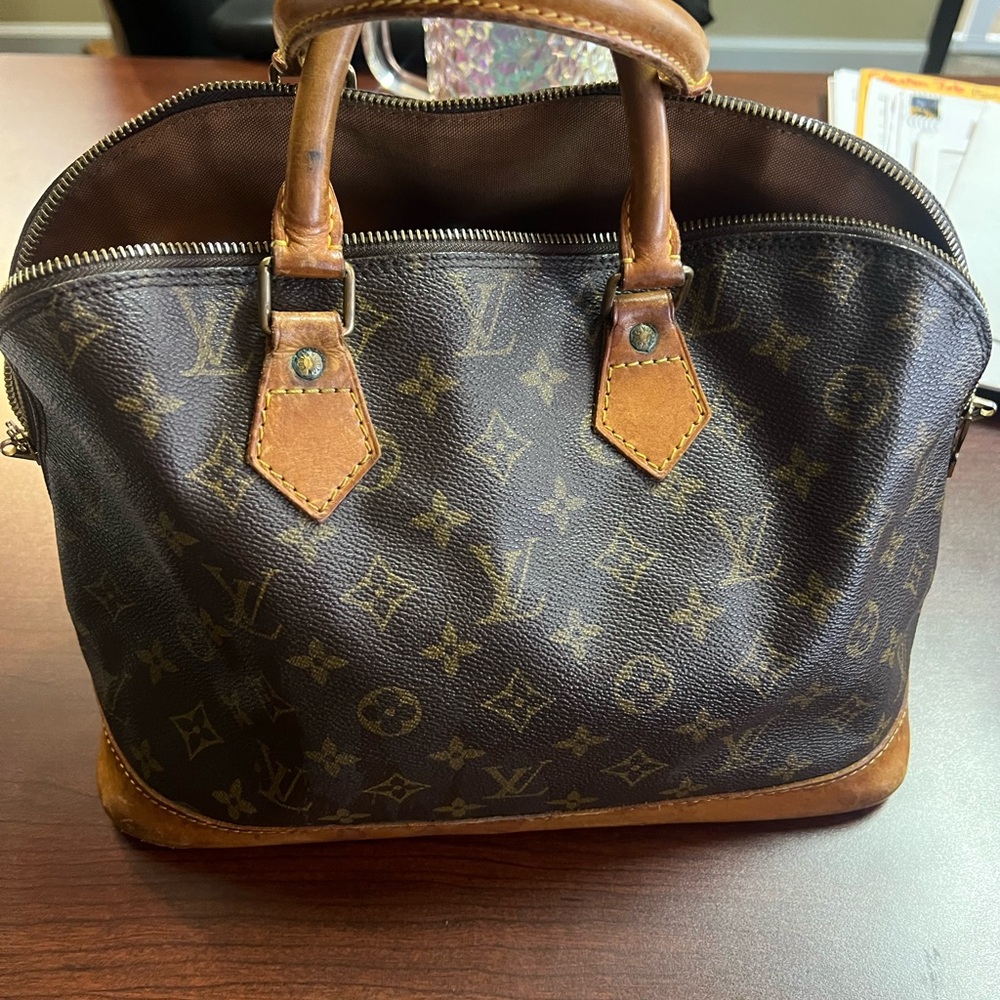 Louis Vuitton Brown Duffel Bag with Iconic Monogram and Structured Shape